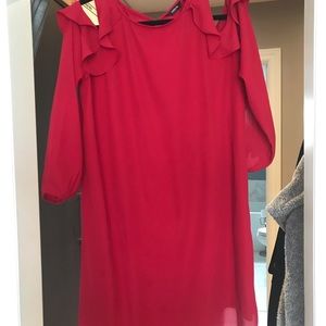 Red dress. Off the shoulder sleeves.